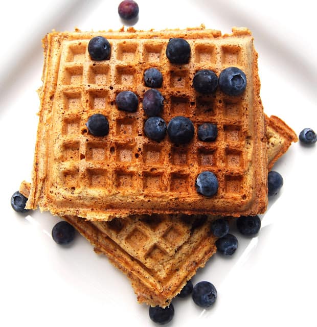 Photo of vegan maple wheat germ waffles with blueberries.