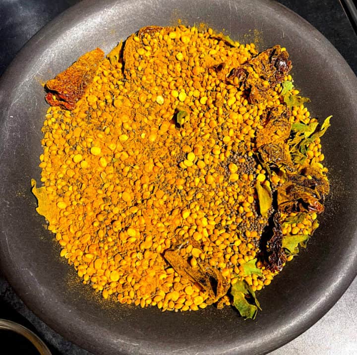 Curry powder ingredients cooling on plate.