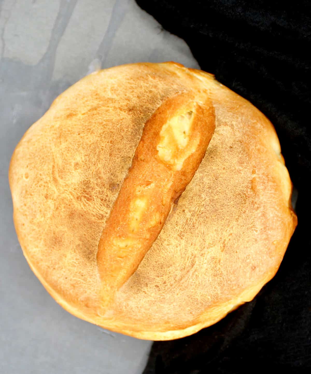 Overhead shot of a freshly baked sourdough loaf.