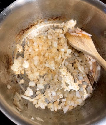 Onions browning in skillet for feijoada
