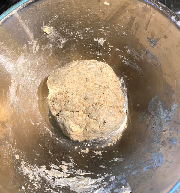 Pie crust dough formed into a ball in bowl.