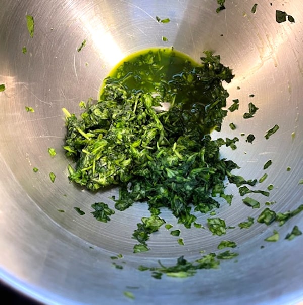 Squeezed salted spinach in bowl.