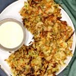 Vegan Hash browns in a white plate with a creamy sauce