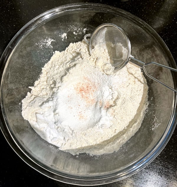 Flour, baking soda, baking powder and salt in a bowl for sheet pan pancakes
