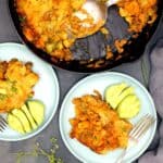 Vegan dinner bake served in two dishes and in cast iron skillet