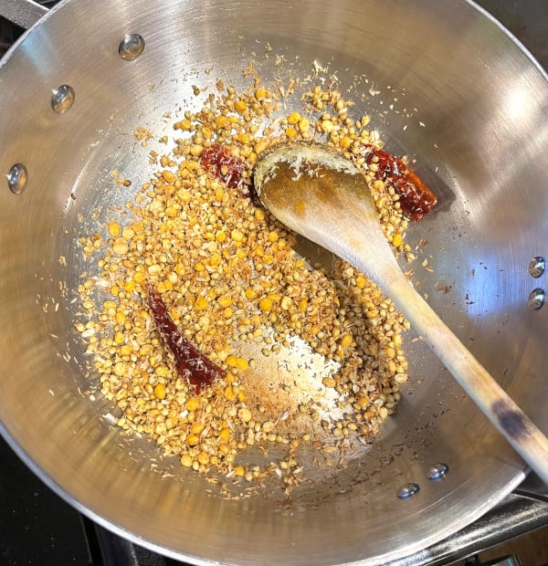 Spices roasting in pan for pitlai