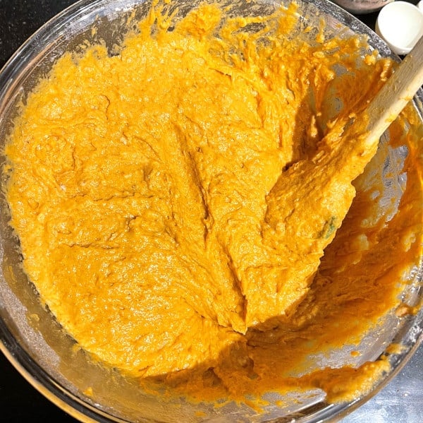 pumpkin cake batter mixed together in bowl