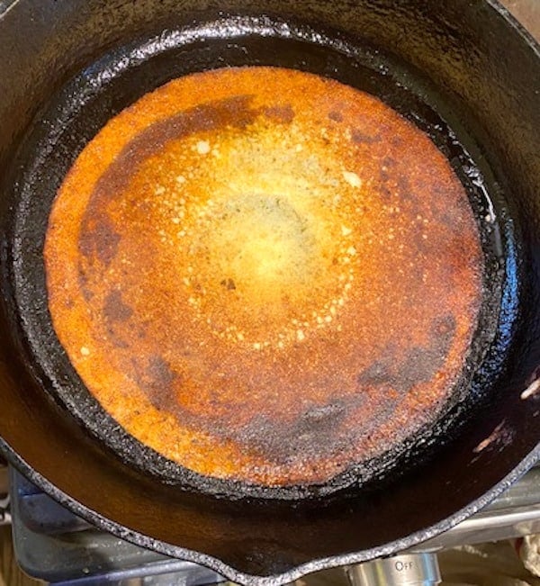 Crispy quinoa dosa on cast iron griddle.