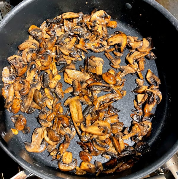 Browned mushrooms in saute pan.