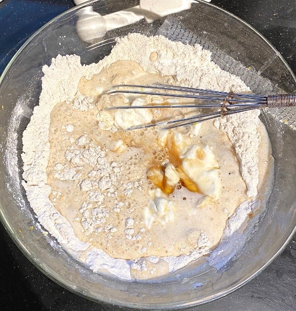 Wet ingredients added to dry in bowl
