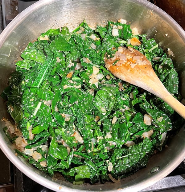 Kale cooking in skillet.