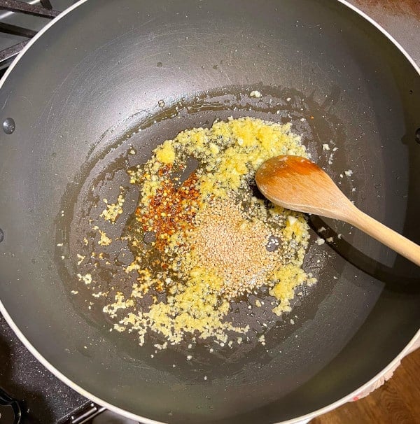 Red pepper flakes and garlic sauteing in olive oil