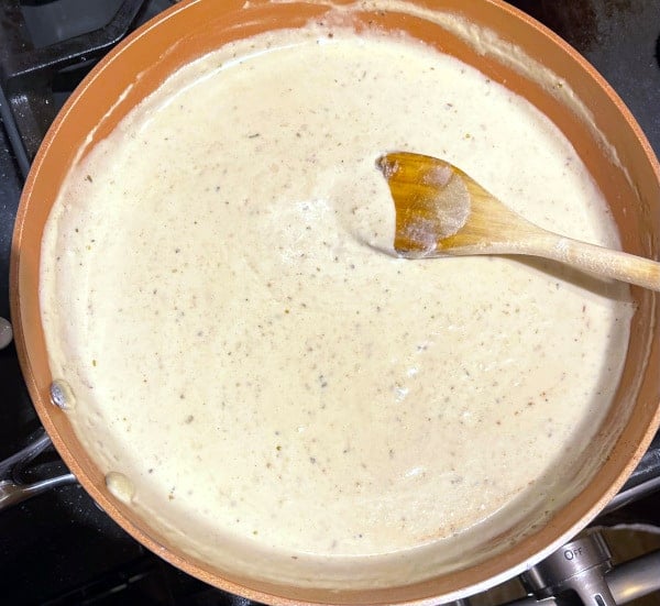 Reduced cashew sauce coating ladle.