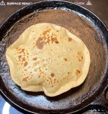 Puffed up roti on griddle or tava