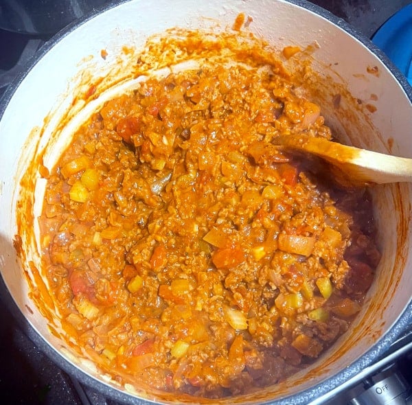 Tomatoes cooked down in chili.
