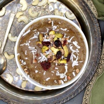 Cashew halwa in bowl with nuts and dry fruits