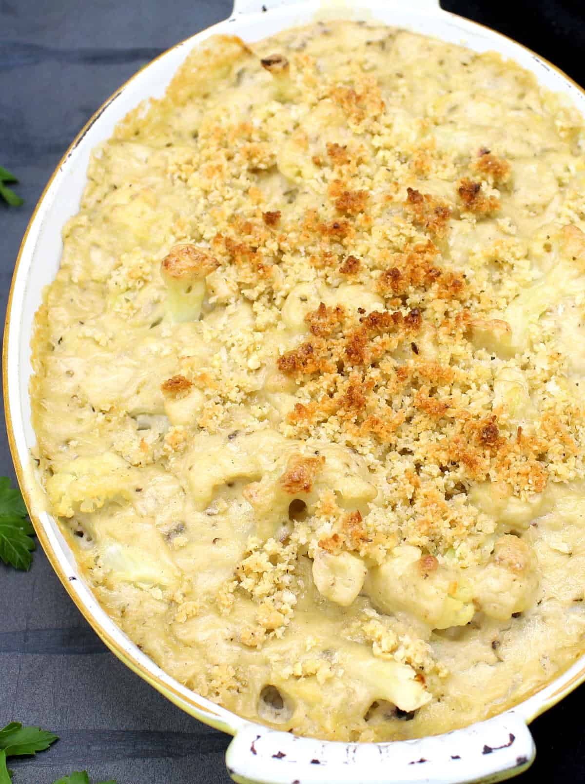 Front photo of a low carb vegan cauliflower casserole with breadcrumb topping.