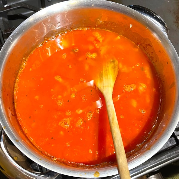 Marinara sauce cooking in pot