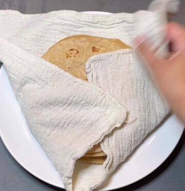 Rotis wrapped in kitchen towel