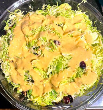Salad with dressing poured over.