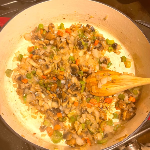 Mushrooms, carrots, onions and celery sauteing.