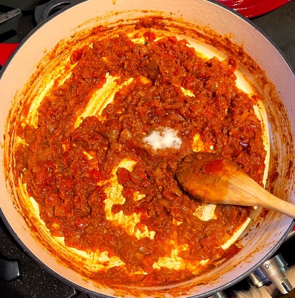Reduced tomato sauce in skillet.