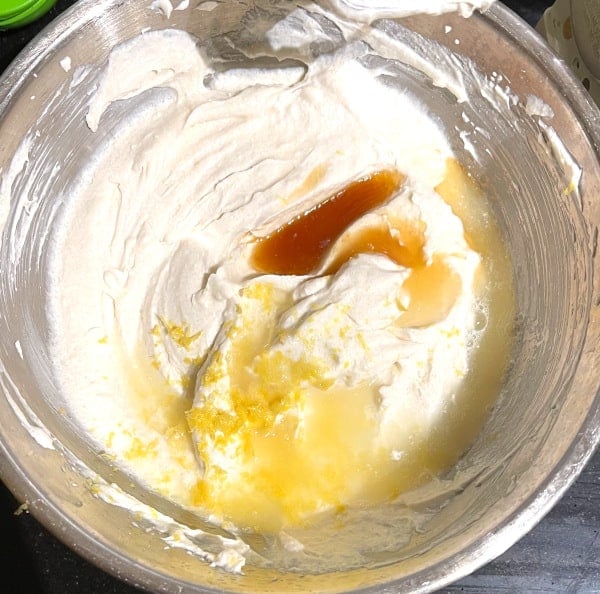 Lemon zest, juice and vanilla added to cheesecake batter.