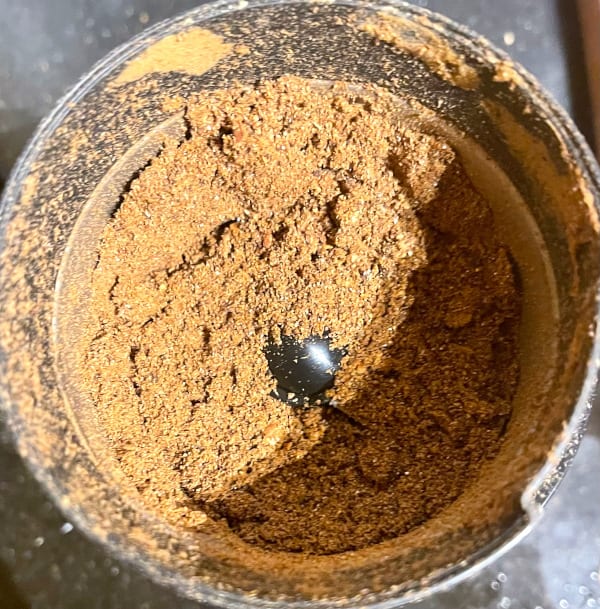 Mekelesha spice blend in spice grinder.