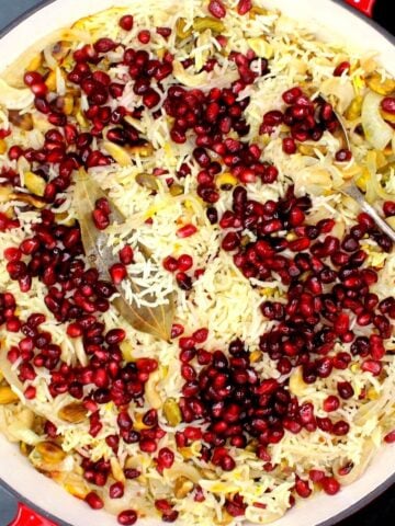 Pomegranate pilaf in a red and white dutch oven.