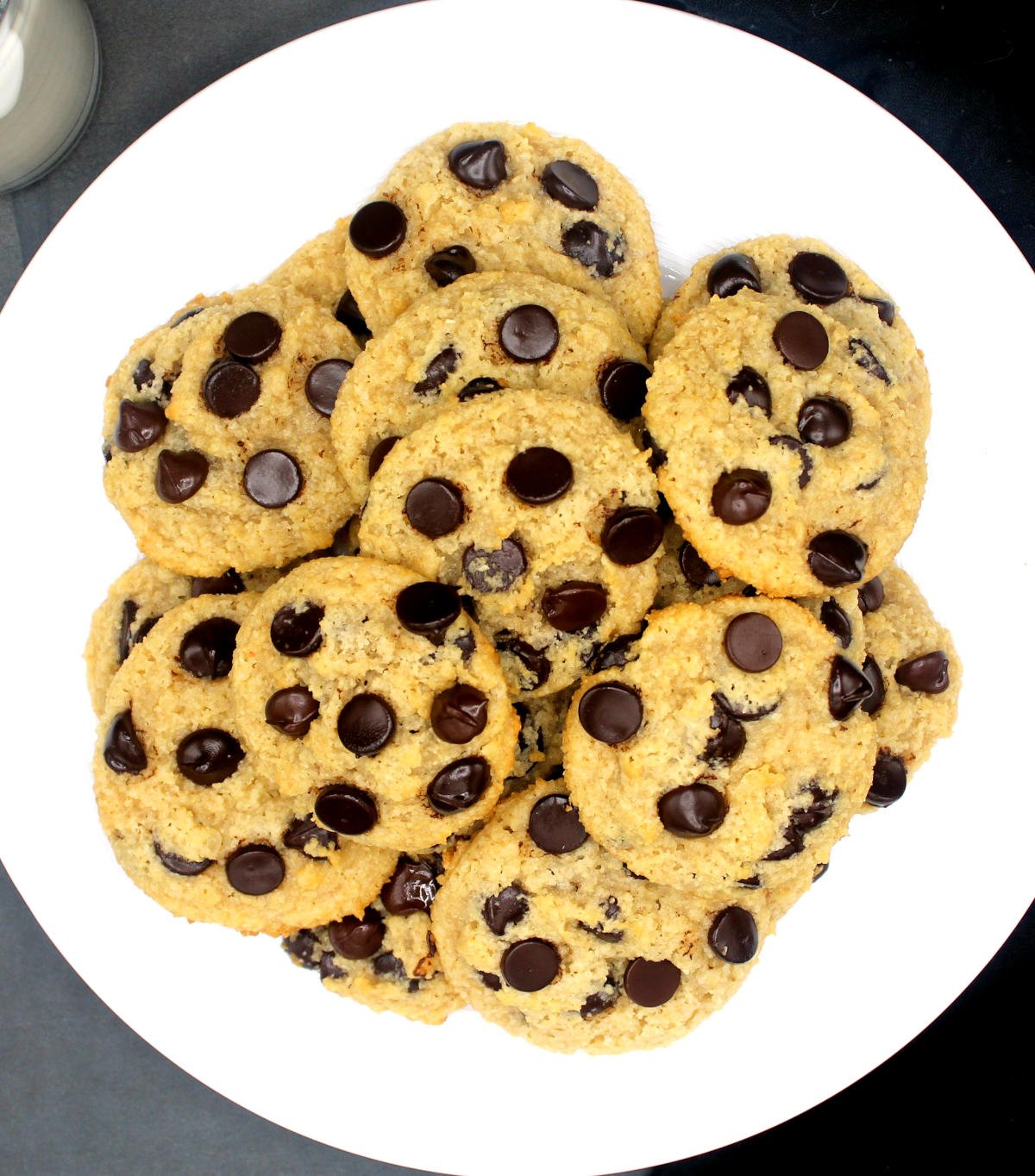 Overhead photo of a plate of vegan keto chocolate chip cookies with lots of chocolate chips.