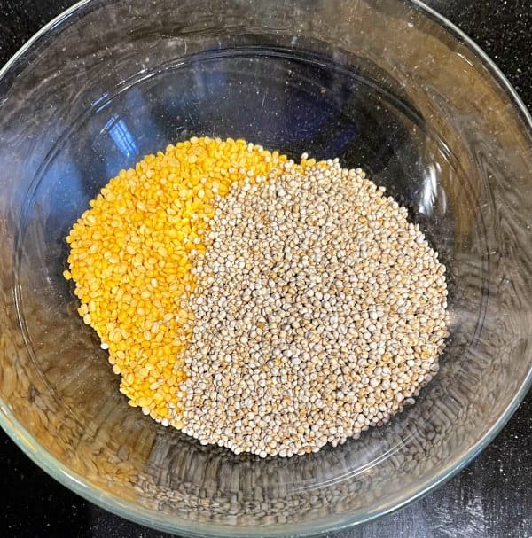 Sorghum and moong dal in bowl, dry.