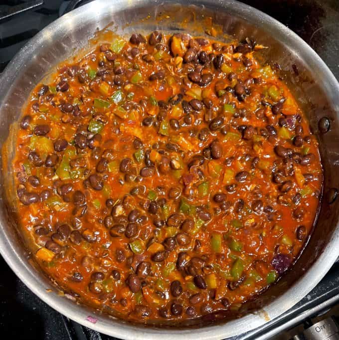 Cooked black beans in skillet.