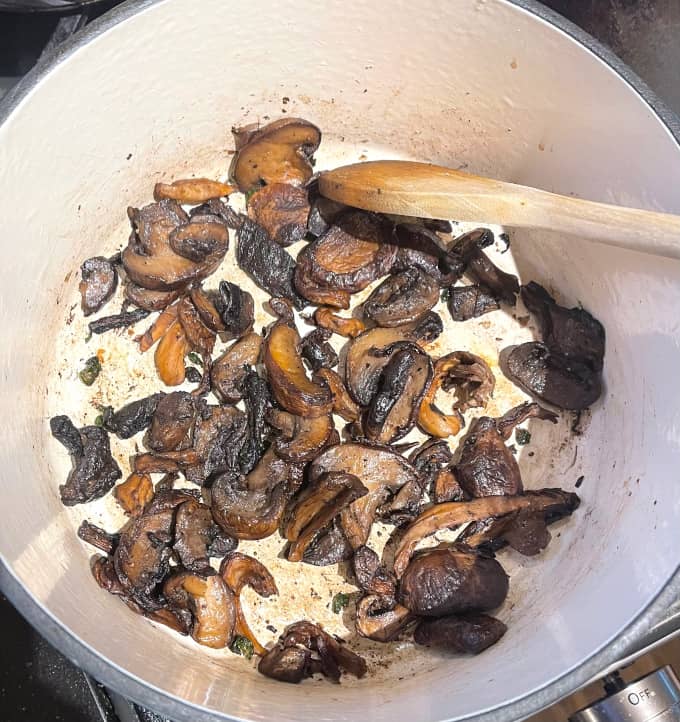 Caramelized mushrooms in pot.