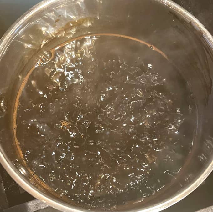Tamarind sauce bubbling away on stove.