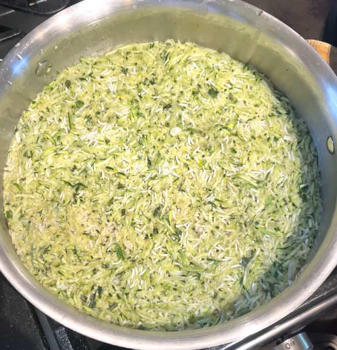 Cooked zucchini rice in pot.