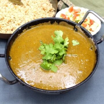 Front shot of karahi with veg dhansak, rice and kachumber.