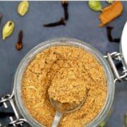 Image of spices and spice blend in a jar with text inlay that says "chai masala powder, aromatic plus delicious"