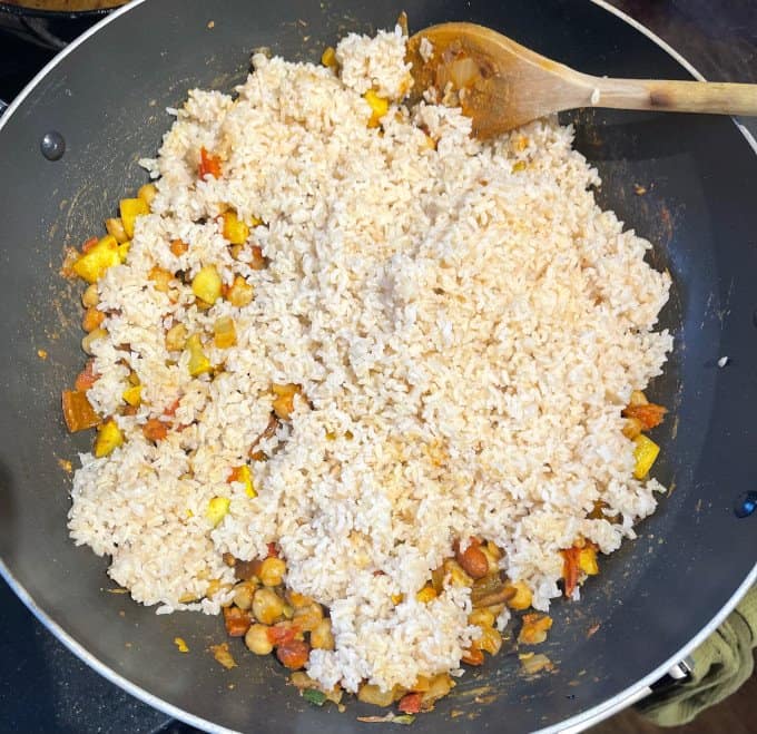 Rice added to wok.