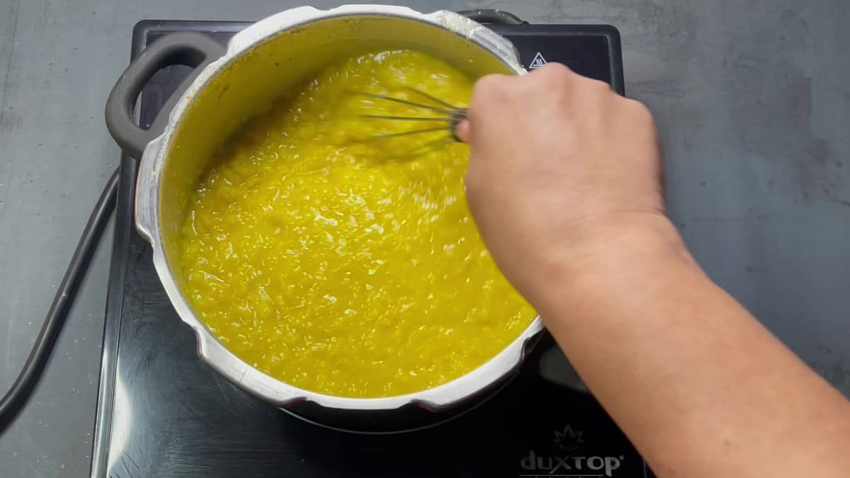 Whisk the dal.