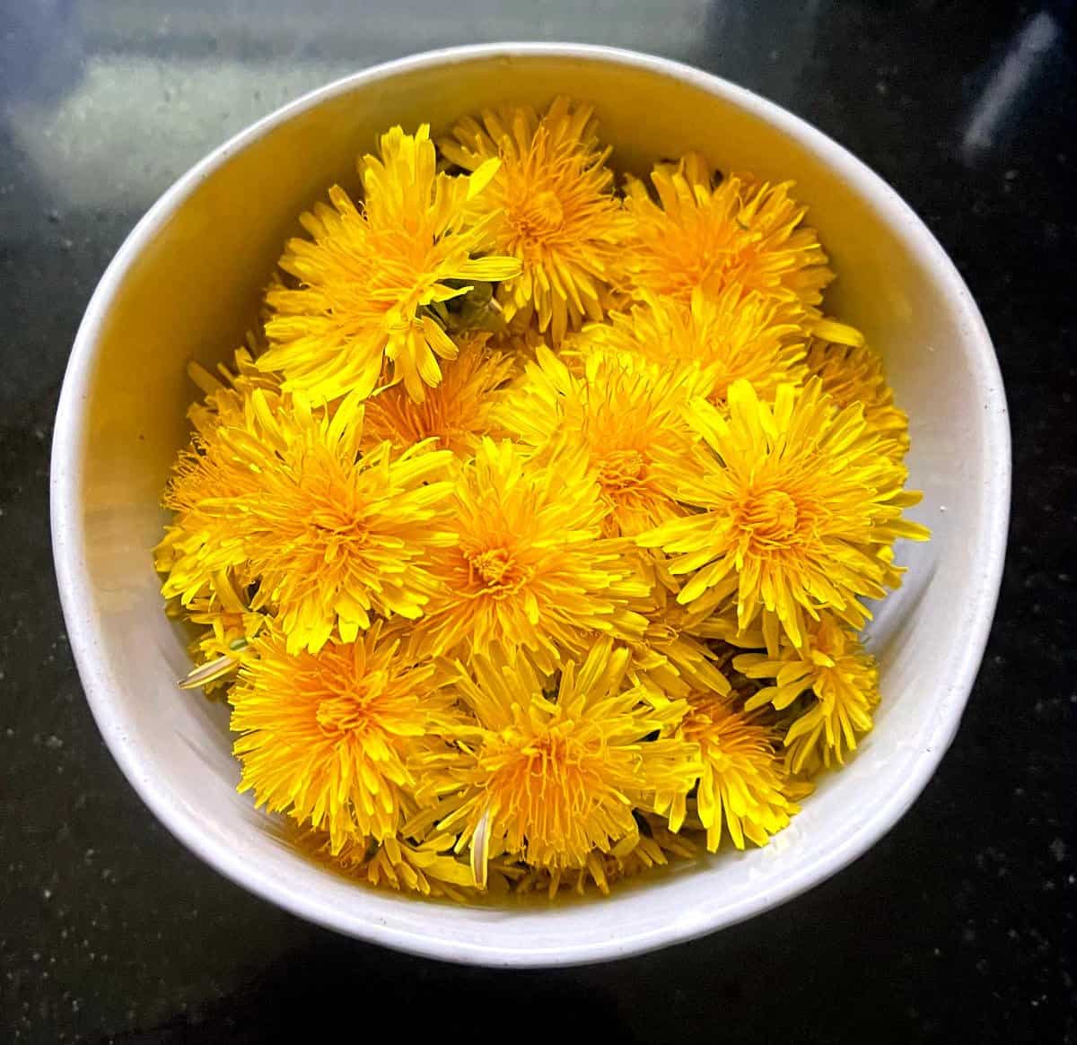 Dandelions in bowl.