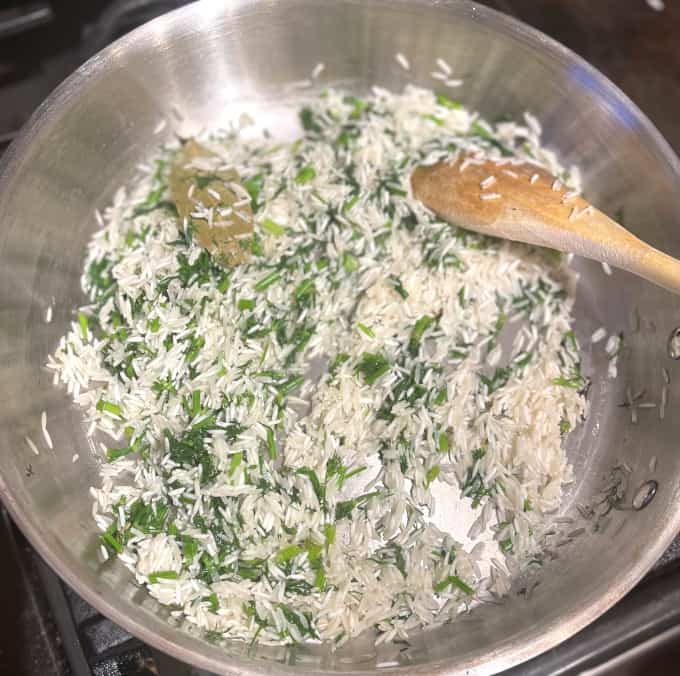Rice added to skillet with dill and spices.