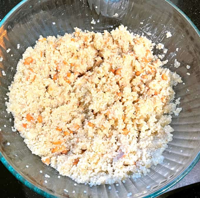 Mashed beans and quinoa in large bowl.