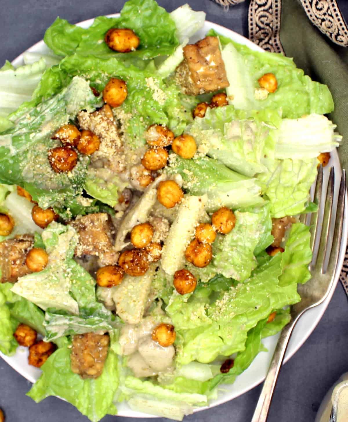 Vegan Caesar Salad with chickpea croutons and tempeh and vegan parmesan cheese.