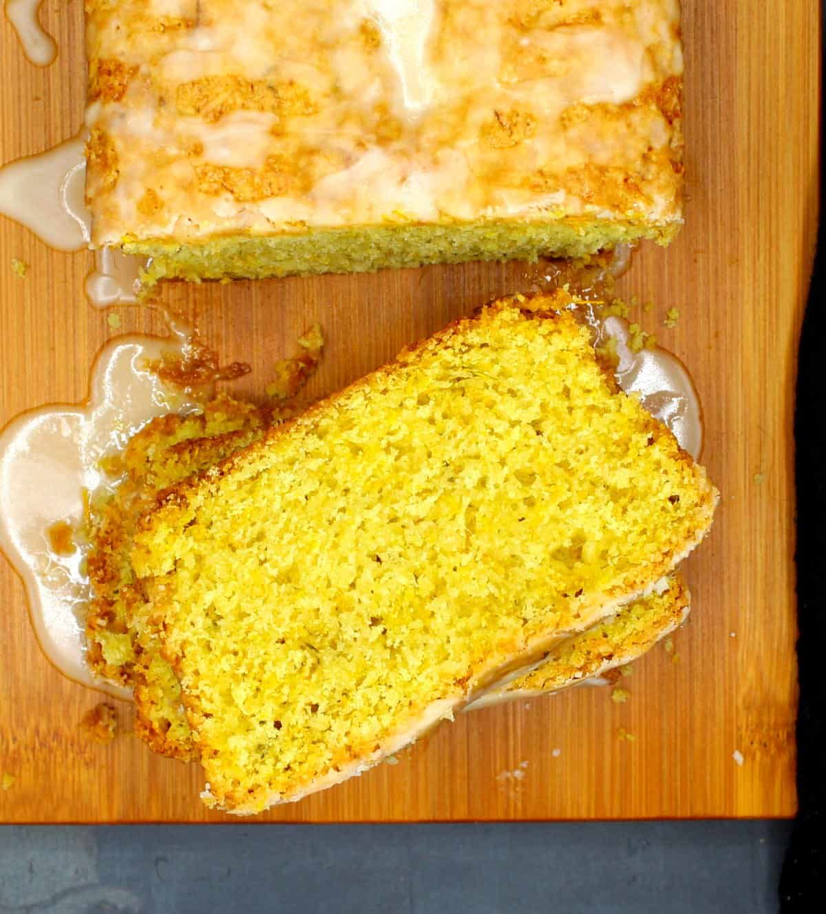 Slices of vegan dandelion bread on chopping board.