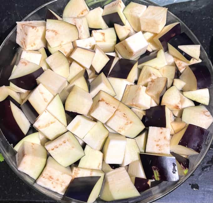 Eggplant cubes in glass bowl.