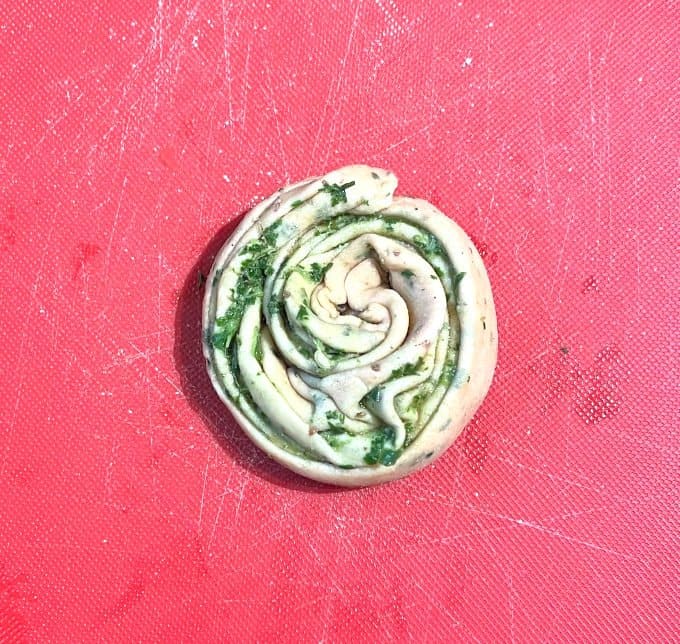 Coiled paratha dough with mint stuffing.