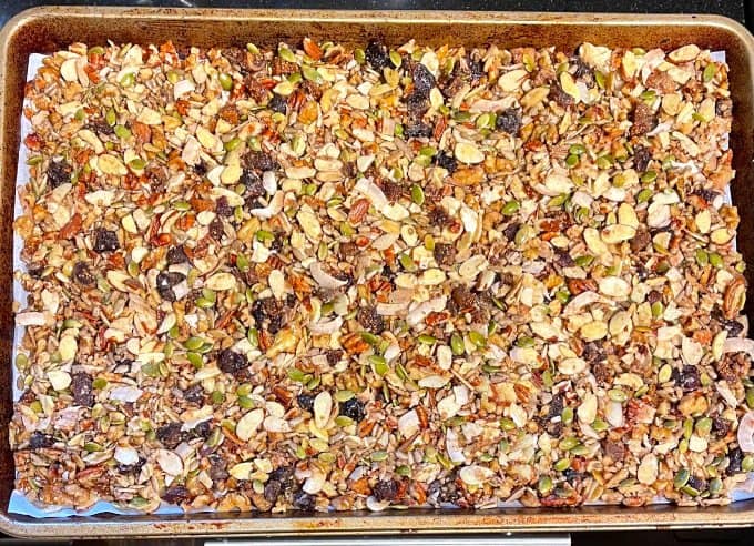 Keto granola spread on baking tray before baking.