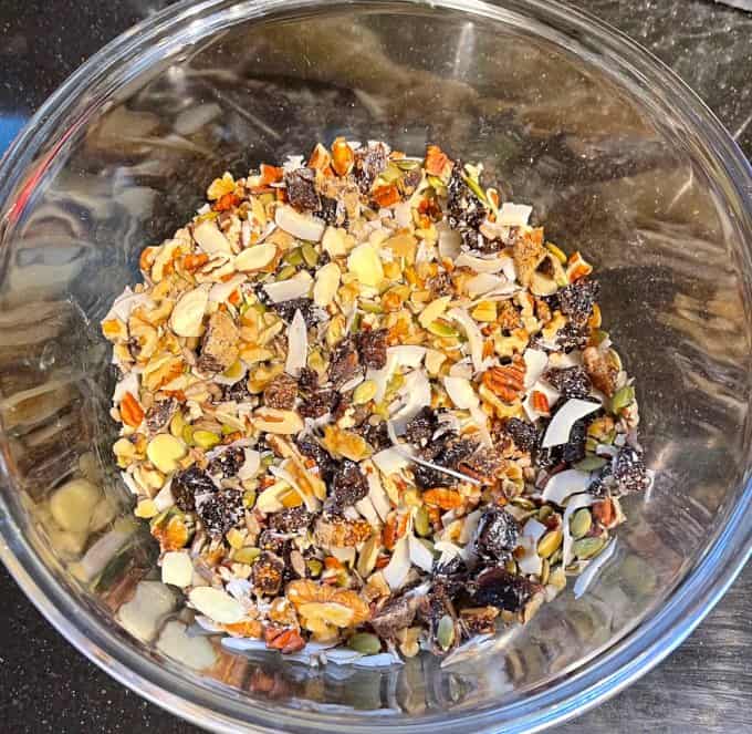 Keto granola dry ingredients in glass bowl.
