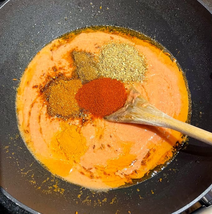 Spices added to tomato onion sauce.