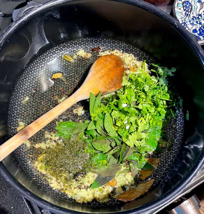 Herbs added to dutch oven.
